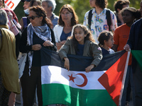 Dozens of protesters walk to commerorate the 60th anniversary of the slaughter of algerian protesters by French police in Paris on October 1...