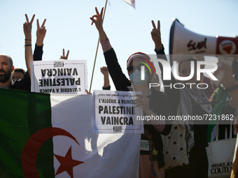 People makes the V sign. Dozens of protesters walk to commerorate the 60th anniversary of the slaughter of algerian protesters by French pol...
