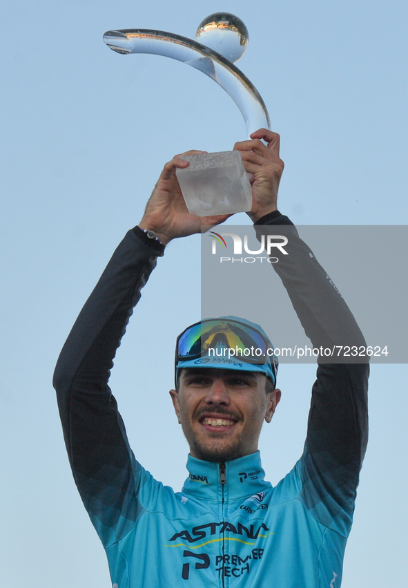 Samuele Battistella of Italy and Astana - Premier Tech team with the race trophy during the Award Ceremony after winning the 2021 edition of...