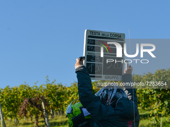 A timekeeper with a times board durin g the first edition of the Veneto Classic, the 207km pro cycling race from Venezia to Bassano del Grap...
