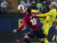 Kike Garcia  of C.A. Osasuna  (L) and Villarreal's  Etienne Capoue   during  La Liga  match between Villarreal CF and C.A. Osasuna   at La C...