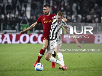 Roma midfielder Bryan Cristante (4) fights for the ball against Juventus midfielder Dejan Kulusevski (44) during the Serie A football match...