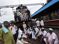 Farmers block railway tracks during a nationwide rail blockade demanding dismissal of Union Minister Ajay Mishra, days after eight people di...