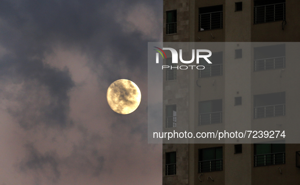 Full moon is seen over Gaza City, on October 18,2021.  