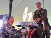 Pastor Sean Moon of the Sanctuary Church lights the opening torches at the 3rd Annual Rod of Iron Freedom Festival on October 9th, 2021. (