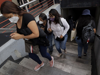 A group of people leave the Bellas Artes metro station, Line 8, near Mexico City's Historic Centre, during the COVID-19 emergency and the of...
