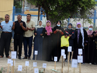 Supporters of the exiled former Palestinian Fatah group security chief, Mohammed Dahlan, take part in a symbolic gathering calling for the r...