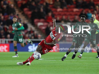   Middlesbrough's Souleymane Bamba slips under pressure from Barnsley's Clarke Oduor during the Sky Bet Championship match between Middlesbr...