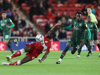   Middlesbrough's Souleymane Bamba slips under pressure from Barnsley's Clarke Oduor during the Sky Bet Championship match between Middlesbr...