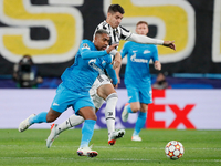 Malcom (L) of Zenit and Alvaro Morata of Juventus vie for the ball during the UEFA Champions League Group H football match between Zenit St....