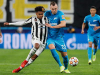 Artem Dzyuba (R) of Zenit and Weston McKennie of Juventus vie for the ball during the UEFA Champions League Group H football match between Z...
