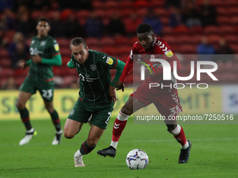  Callum Brittain of Barnsley in action with Middlesbrough's Isaiah Jones during the Sky Bet Championship match between Middlesbrough and Bar...