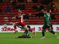 Middlesbrough's Martin Payero in action with Barnsley's William Hondermarck during the Sky Bet Championship match between Middlesbrough and...