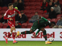 Middlesbrough's Marcus Tavernier battles with Barnsley's Aaron Leya Iseka  during the Sky Bet Championship match between Middlesbrough and B...