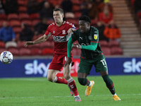 Middlesbrough's Jonathan Howson battles for possession with Barnsley's Aaron Leya Iseka  during the Sky Bet Championship match between Middl...