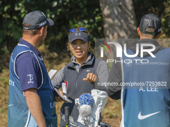 Alison lee of USA and two caddy talk before shot on on the 3th green during an BMW LADIES CHAMPIONSHOP at BMW International GC in Busan, Sou...