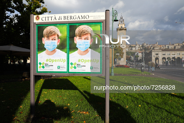 A poster of Covid-19 vaccination campaign is seen in the city of Bergamo, Italy on October 5, 2021.  