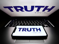 TRUTH Social logos displayed on a phone and a laptop screens are seen in this illustration photo taken in Poland on October 22, 2021. TRUTH...