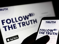 TRUTH Social website is seen displayed on a phone and a laptop screens in this illustration photo taken in Poland on October 22, 2021. TRUTH...