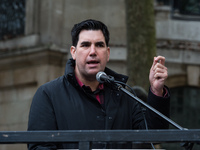 LONDON, UNITED KINGDOM - OCTOBER 23, 2021: Labour Party MP Richard Burgon speaks during a rally outside the Royal Courts of Justice in solid...