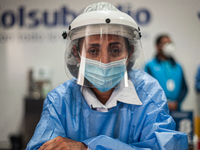 A vaccination team nurse poses for a portrait as the Colombian government begins to vaccinate children between ages 3 to 11 against the Coro...