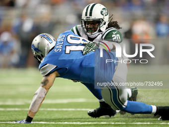 Detroit Lions' Greg Salas gets tackled by New York Jets' Marcus Williams during the first half of the 2015 NFL preseason football game in De...