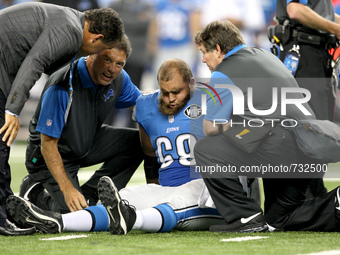 Detroit Lions C Darren Keyton is checked during the first half of the 2015 NFL preseason football game against the New York Jets in Detroit,...