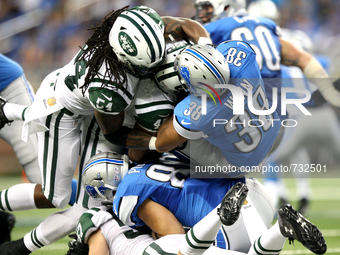 Detroit Lions RB George Win (38) gets tackled by New York Jets ILB Jamari Lattimore (54) and SS Rontez Miles (45) during the second half of...