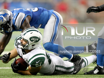 New York Jets WR Eric Decker (87) is stopped by Detroit Lions S James Ihedigbo (32) during the first half of the 2015 NFL preseason football...