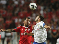 Benfica's forward Kostas Mitroglou  (L) vies for the ball with Estoril's defender Yohan Tavares  (R) during the Portuguese League football m...