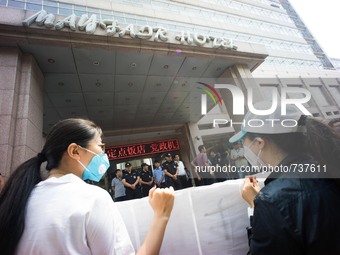 Protesters seen outside the Mayfair hotel where the daily press conference is being held. - Hundreds of residents from near the chemical exp...