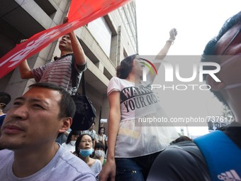 A female protester chanting 