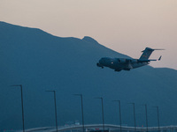 A US Air Force C-17 Globemaster plane lands at the Hong Kong International Airport. (