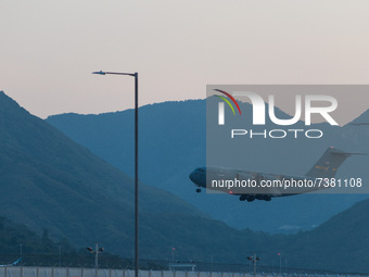 A US Air Force Boeing C-17A Globemaster plane lands at the Hong Kong International Airport. (