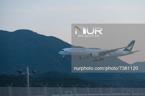 An Airbus A350-941 of Cathay Pacific lands at Hong Kong International Airport. 