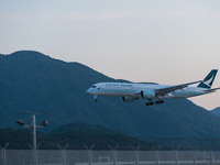 An Airbus A350-941 of Cathay Pacific lands at Hong Kong International Airport. (