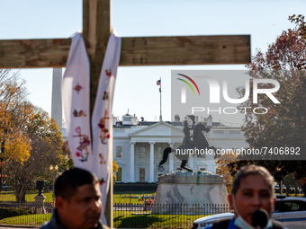 Immigration activists with National TPS Alliance speak during a direct action at the White House.  Activists are hanging on crosses all day...