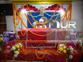 A Sikh devotee performs rituals on the occasion of Guru Nanak Jayanti held in Guru Nanak Satsang Gurdwara in Lalitpur, Nepal on Friday, Nove...