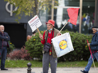 A large group of people demonstrate with posters and flags in the streets demanding better working conditions, on November 20, 2021 in Lisbo...