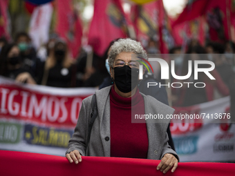 Isabel Camarinha from CGTP demonstrate with posters and flags in the streets demanding better working conditions, on November 20, 2021 in Li...