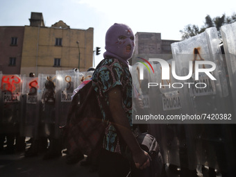 A transgender community  member  confronts riot police during a demonstration against transphobia and demanded justice for the trans femicid...