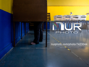 Osorno, Chile. November 21, 2021.-
Voters inside the voting booth during the presidential elections that are held in conjunction with the el...