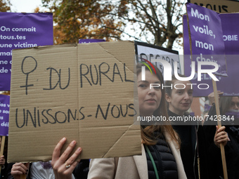 A woman holds a cardboard reading 'Rural'women, let's us unite'. Women from the collective NousToutes organized a protest Toulouse against s...