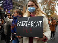 A yopung woman holds a placard 'Patriarchy kills'. Women from the collective NousToutes organized a protest Toulouse against sexual violence...