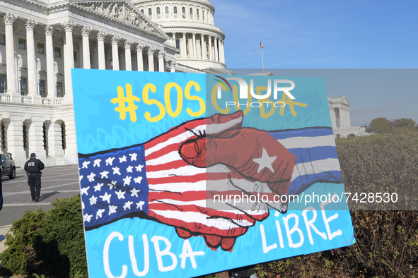 A sign is seen in front of Capitol during the press conference about November 15 Cuba protests today on November 16, 2021 at House Triangle/...