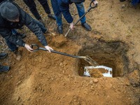 Men bury in the muslim cemetery of Bohoniki the coffin of a miscarried baby from a migrant woman found in precarious state in the forests of...