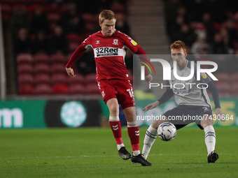 Middlesbrough's Duncan Watmore and Sepp van den Berg of Preston North End  during the Sky Bet Championship match between Middlesbrough and P...