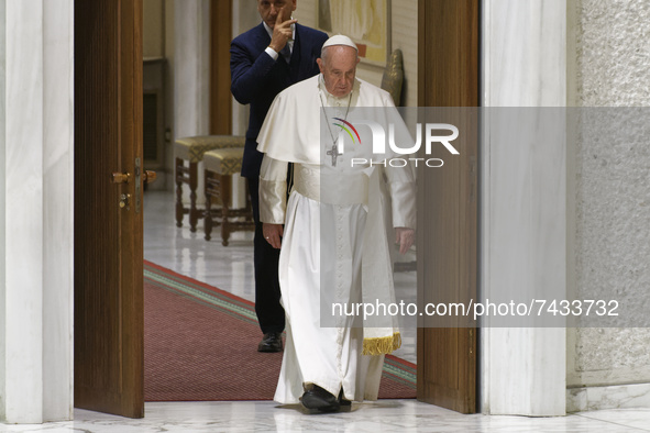 Pope Francis arrives in the Paul VI Hall for his weekly general audience at the Vatican, Wednesday, Nov. 24, 2021.  