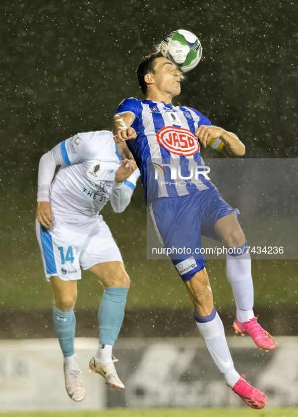 Alex Willson of Olympic FC headers the ball during the FFA Cup round of 32 match between Sydney Olympic FC and Sydney FC at Belmore Sports G...