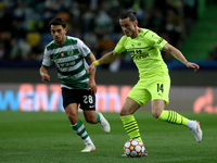 Nico Schulz of Borussia Dortmund (R ) vies with Pedro Goncalves of Sporting CP during the UEFA Champions League Group C football match betwe...